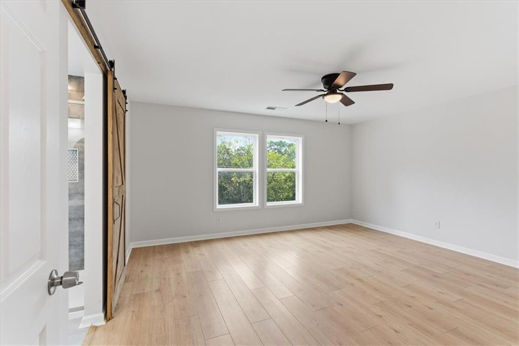 119 Jackson Street Cedartown, GA 30125 - Photo 37 of 58 a view of room with window ceiling fan and hardwood floor