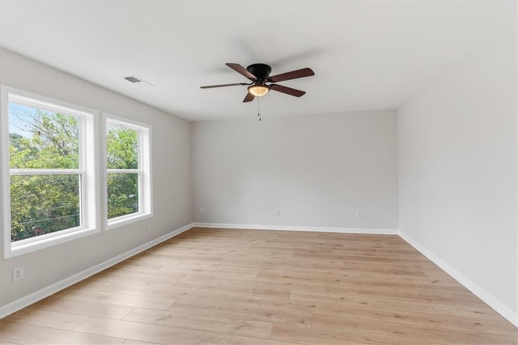 119 Jackson Street Cedartown, GA 30125 - Photo 40 of 58 wooden floor in an empty room with a window
