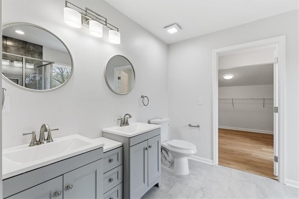 119 Jackson Street Cedartown, GA 30125 - Photo 41 of 58 a bathroom with a toilet a sink and a mirror