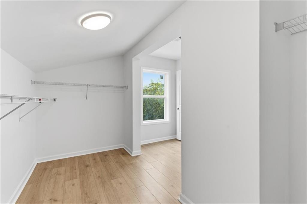 119 Jackson Street Cedartown, GA 30125 - Photo 46 of 58 an empty room with wooden floor and windows