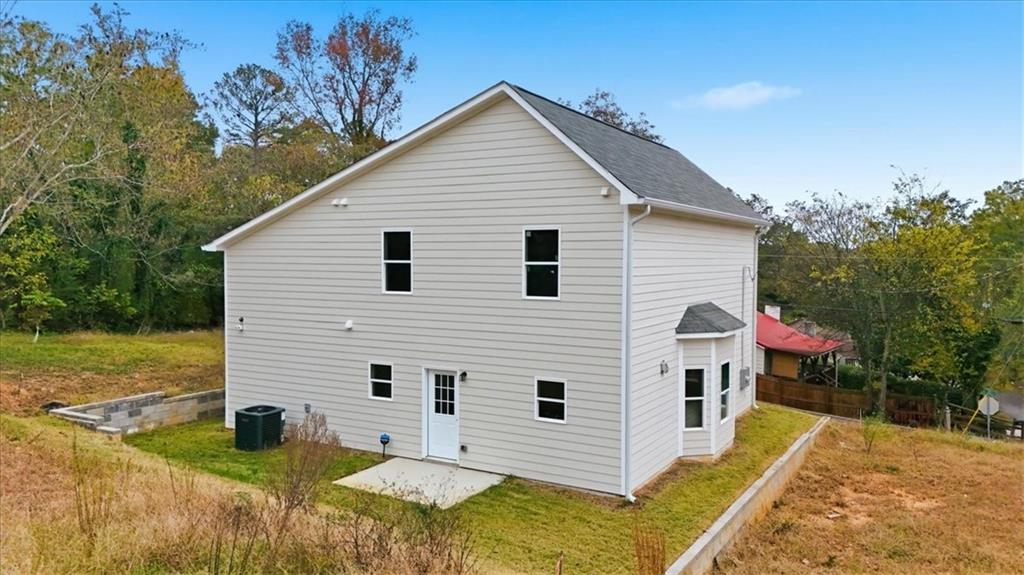119 Jackson Street Cedartown, GA 30125 - Photo 47 of 58 a view of a white house with a yard