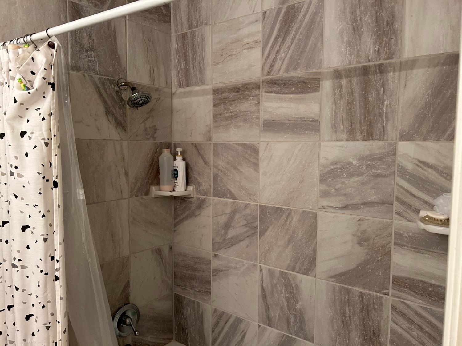 11150 Trinity River Drive, Unit 41 Rancho Cordova, CA 95670 - Photo 8 of 10 a bathroom with a shower