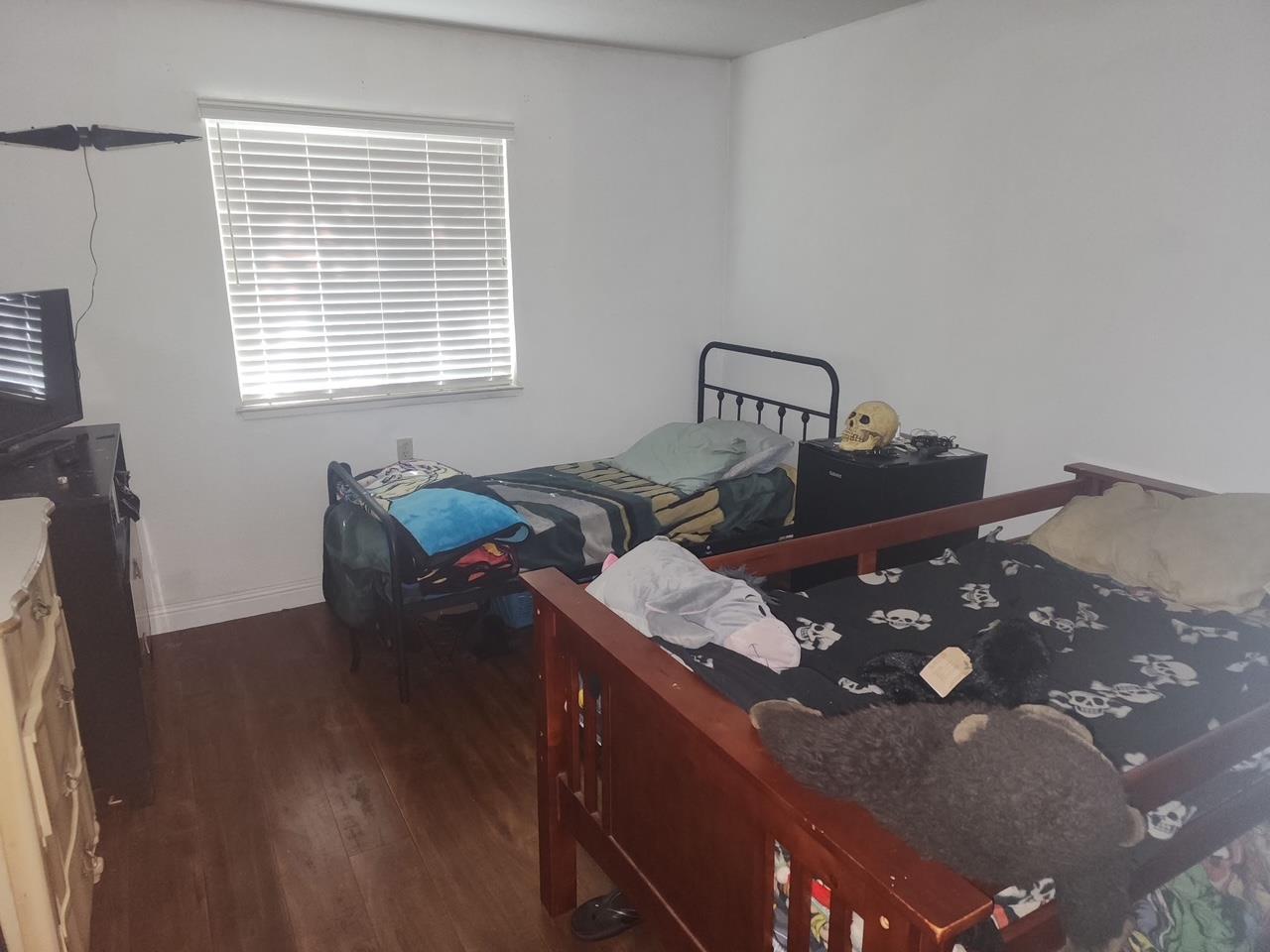 11150 Trinity River Drive, Unit 41 Rancho Cordova, CA 95670 - Photo 10 of 10 a bed sitting in a bedroom next to a window