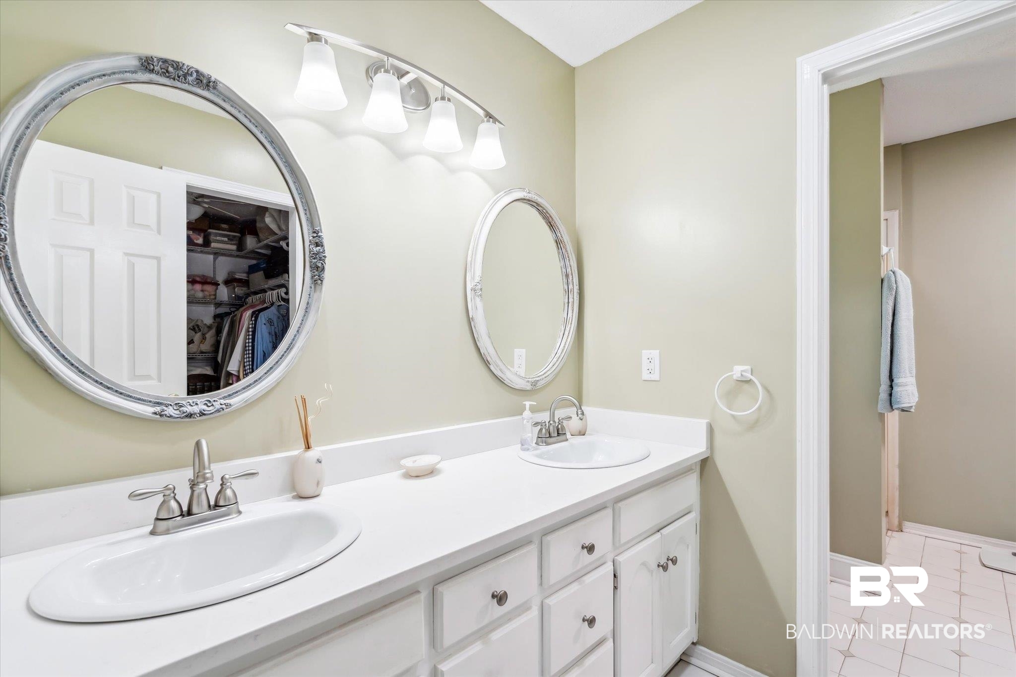 8710 Three Notch Road Mobile, AL 36619 - Photo 15 of 30 Bathroom with double sink vanity and tile patterned flooring