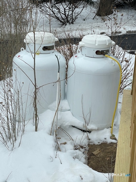 1 Cedar Road Danbury, CT 06811 - Photo 13 of 24 a bed sitting in a bedroom next to a window