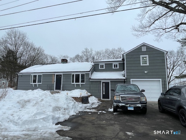 1 Cedar Road Danbury, CT 06811 - Photo 2 of 24 a car parked in front of a house