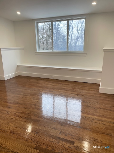 1 Cedar Road Danbury, CT 06811 - Photo 22 of 24 a view of an empty room with a window and wooden floor