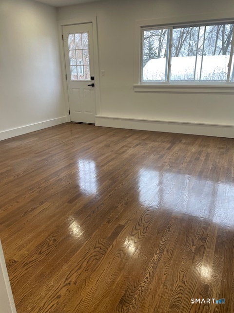 1 Cedar Road Danbury, CT 06811 - Photo 23 of 24 an empty room with wooden floor and windows