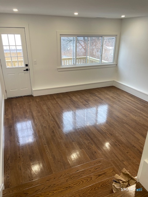 1 Cedar Road Danbury, CT 06811 - Photo 24 of 24 an empty room with wooden floor and windows