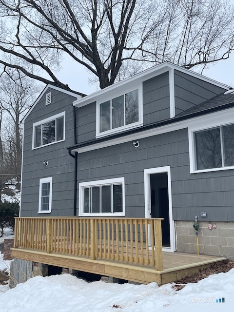 1 Cedar Road Danbury, CT 06811 - Photo 3 of 24 a front view of a house with garage