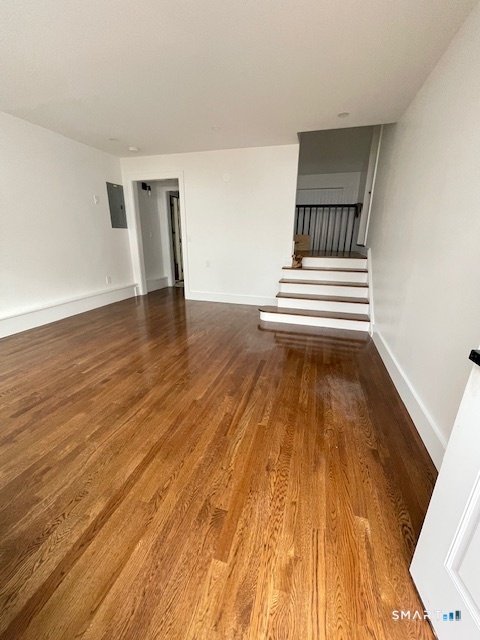 1 Cedar Road Danbury, CT 06811 - Photo 8 of 24 a view of a room with wooden floor and white walls