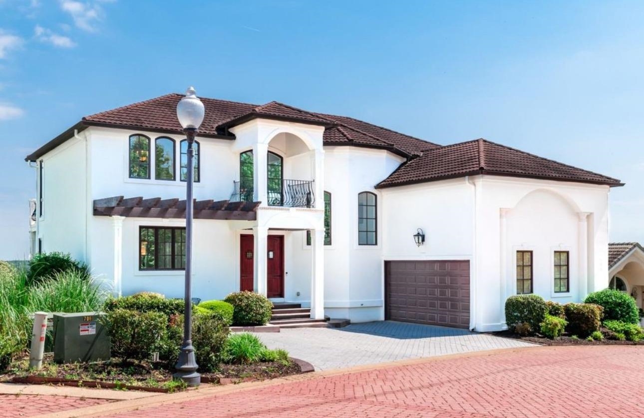 a front view of a house with yard