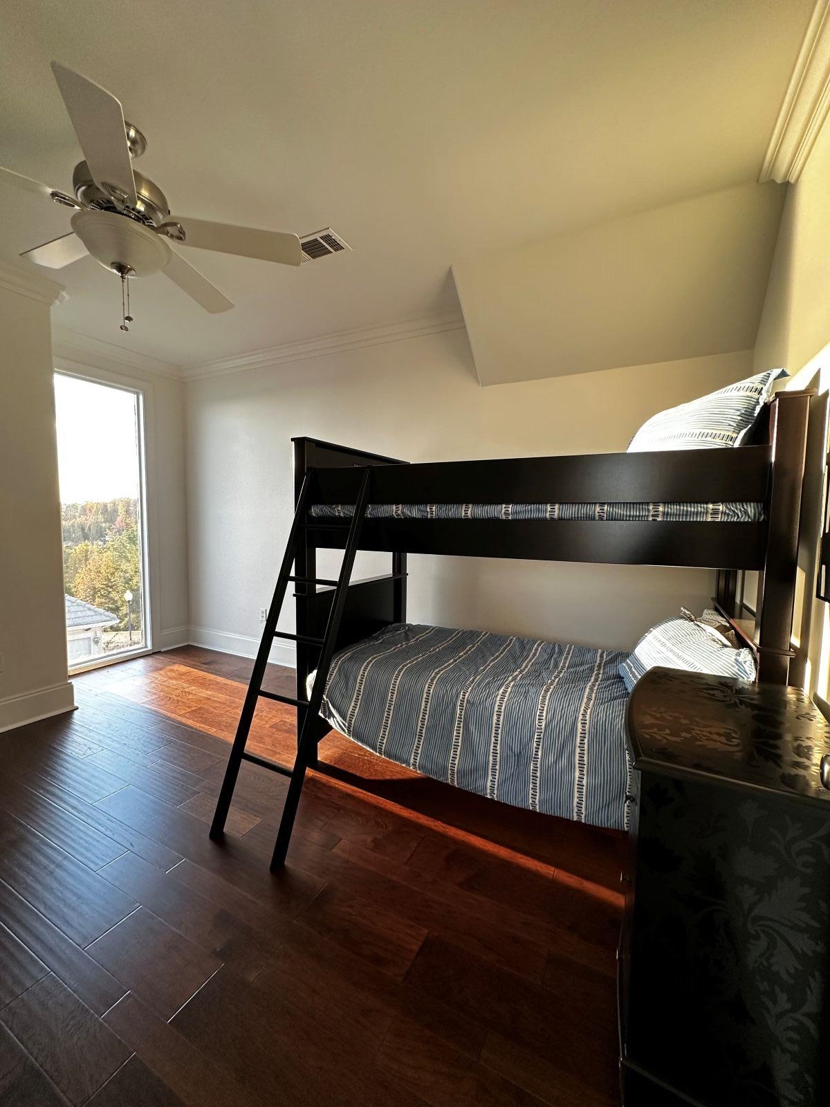 115 Westshore Ridge Savannah, TN 38372 - Photo 17 of 21 a bedroom with a bed and wooden floor