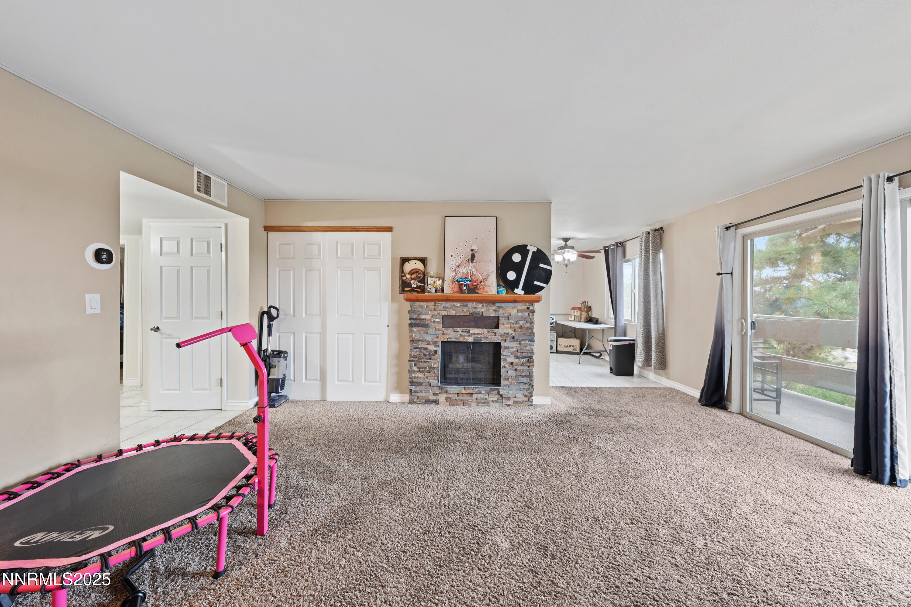 3031 Cashill Boulevard Reno, NV 89509 - Photo 13 of 22 a living room with furniture and a fireplace