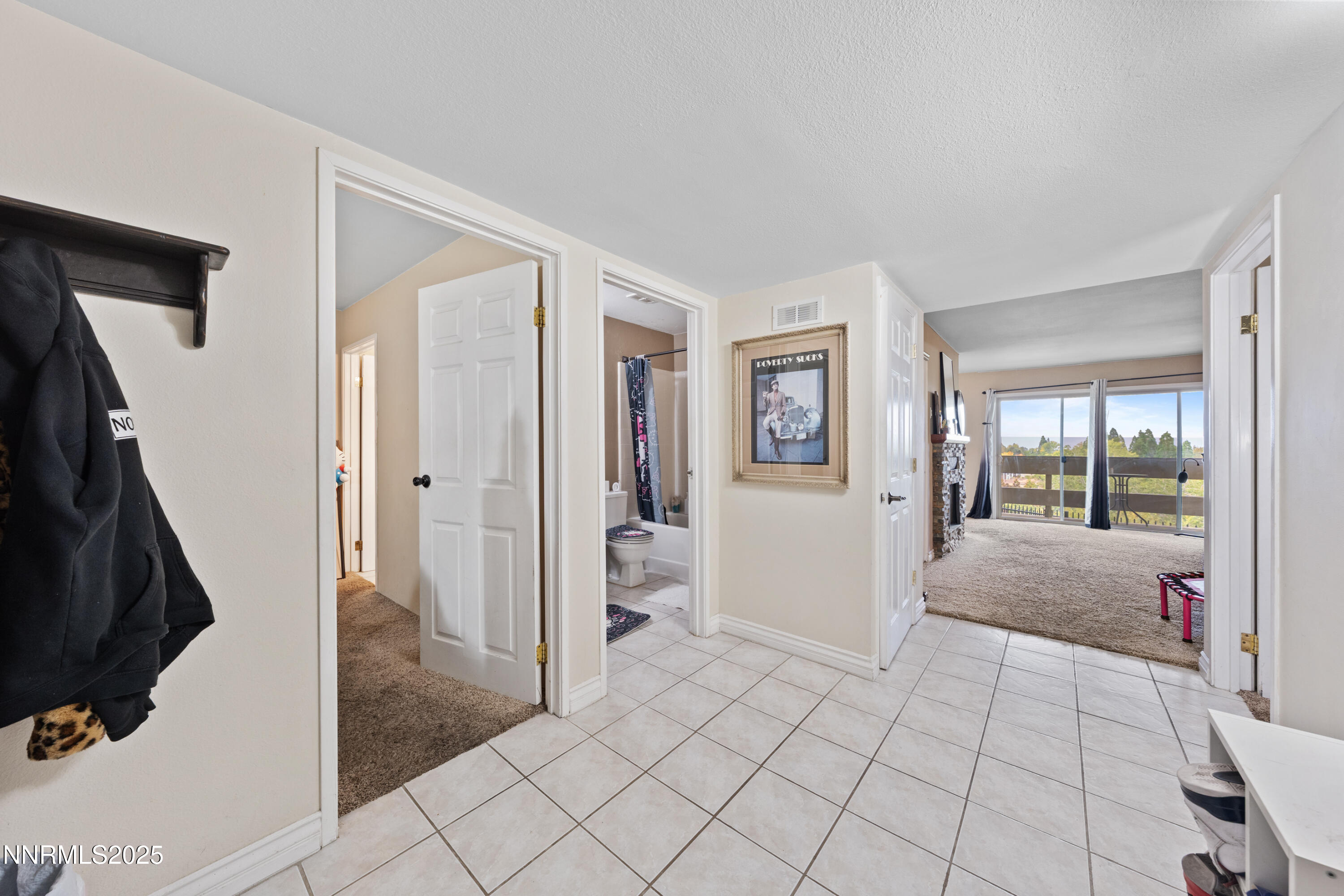 3031 Cashill Boulevard Reno, NV 89509 - Photo 2 of 22 a bathroom with a tub shower and a sink