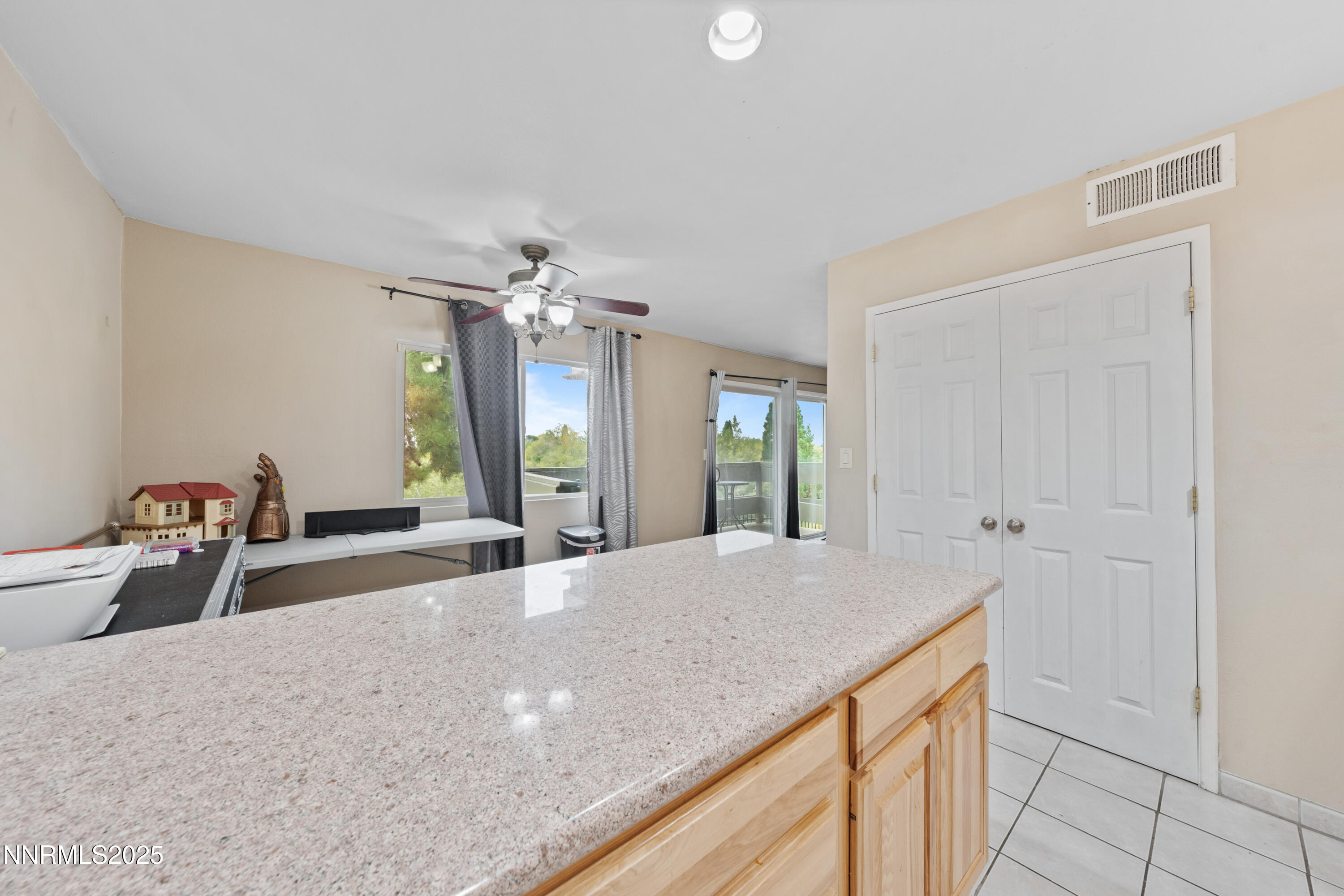 3031 Cashill Boulevard Reno, NV 89509 - Photo 5 of 22 a spacious bathroom with a granite countertop sink a large mirror and shower