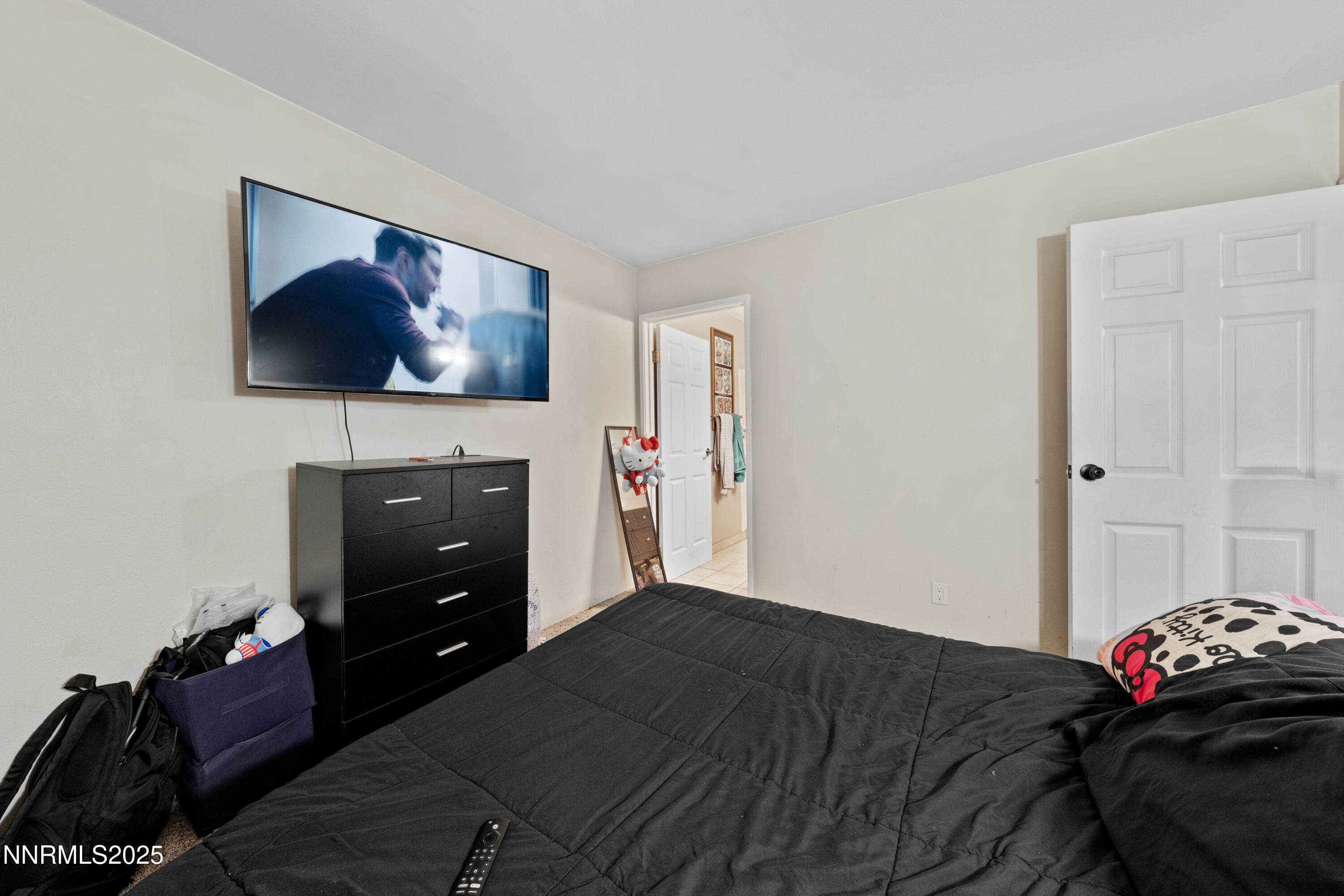 3031 Cashill Boulevard Reno, NV 89509 - Photo 8 of 22 a bedroom with a bed and a television