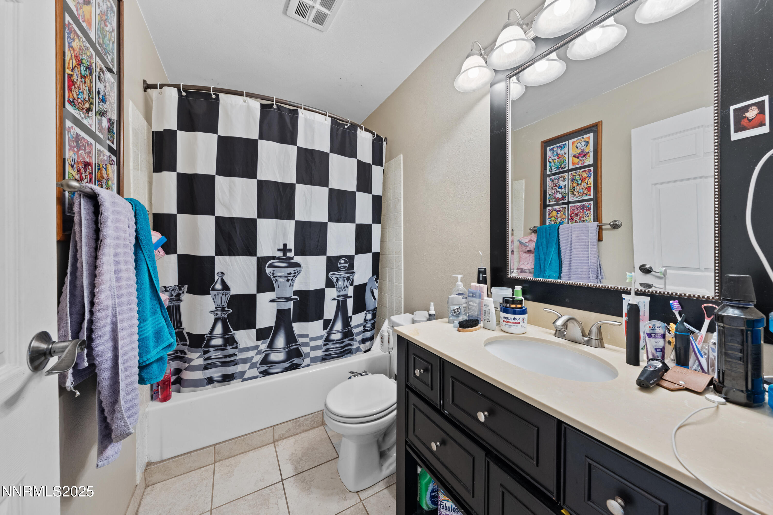 3031 Cashill Boulevard Reno, NV 89509 - Photo 9 of 22 a bathroom with a sink a toilet and shower