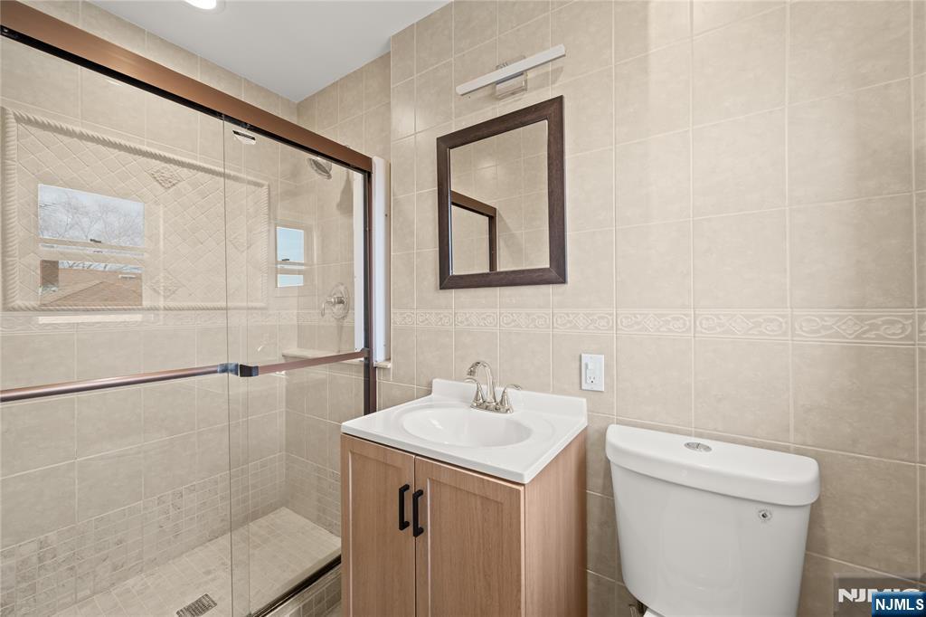 181 Haddenfield Road Clifton, NJ 07013 - Photo 15 of 34 a bathroom with a sink a toilet and shower