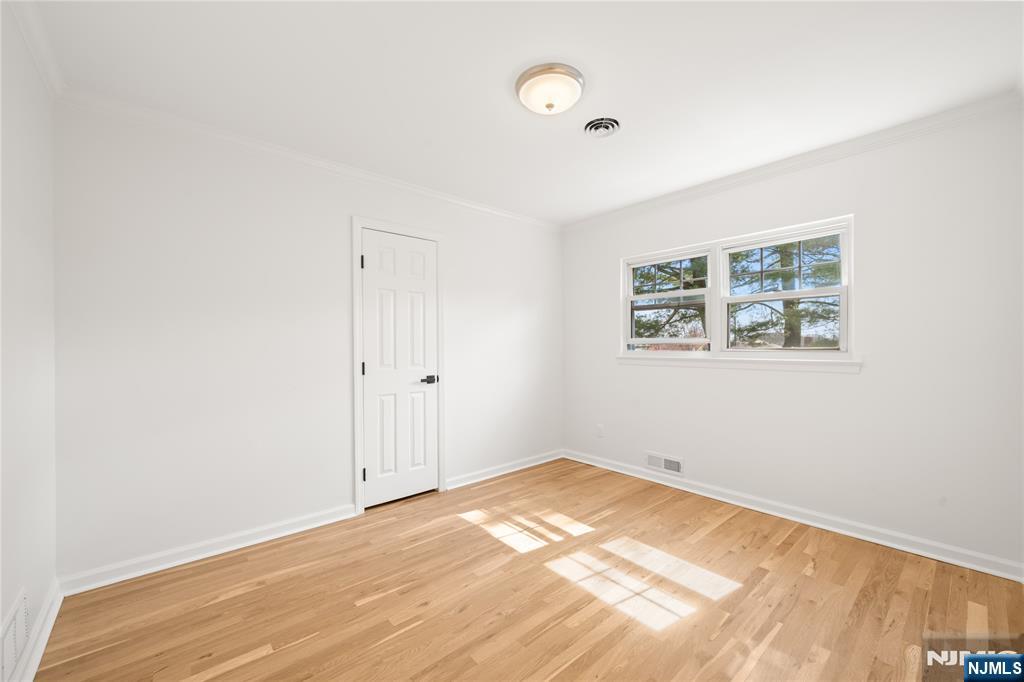 181 Haddenfield Road Clifton, NJ 07013 - Photo 17 of 34 a view of empty room with wooden floor