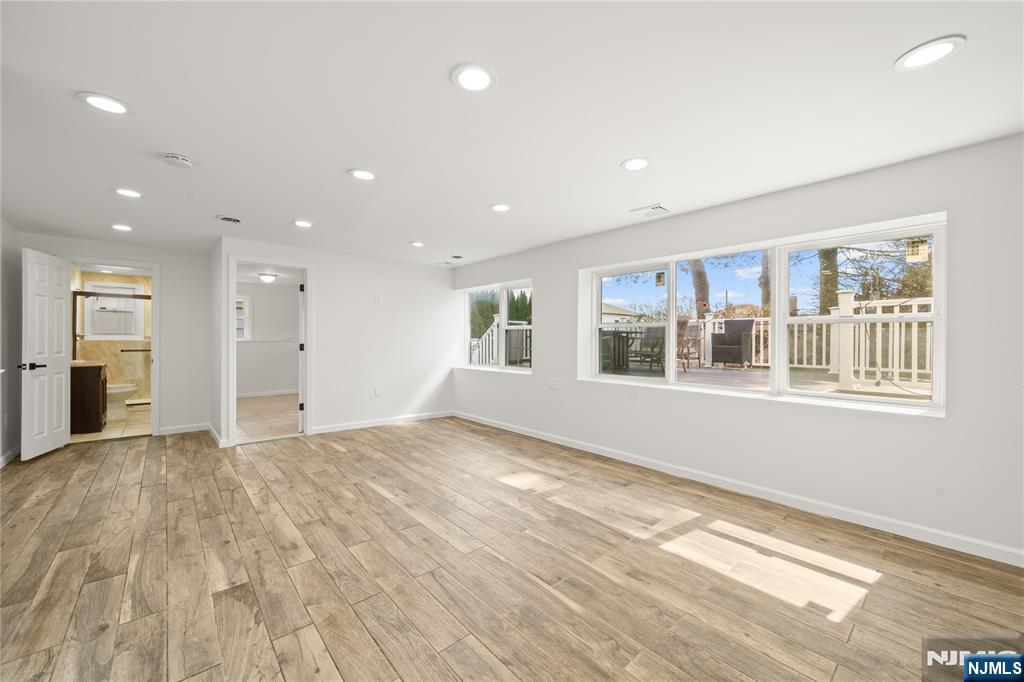 181 Haddenfield Road Clifton, NJ 07013 - Photo 22 of 34 a view of empty room with wooden floor and windows