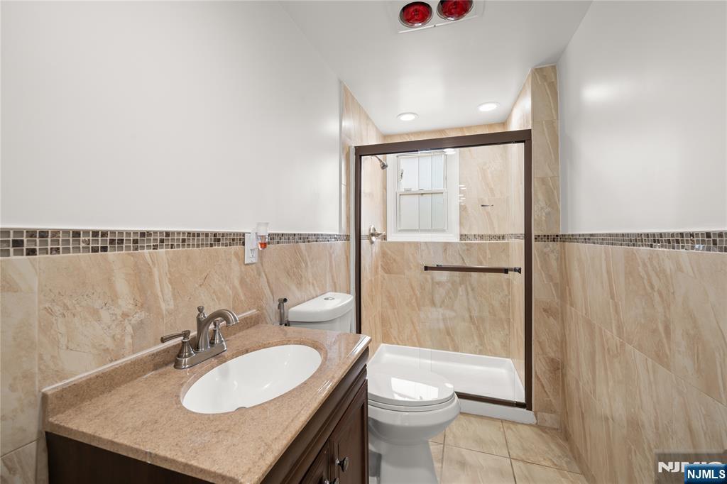 181 Haddenfield Road Clifton, NJ 07013 - Photo 24 of 34 a bathroom with a sink toilet and shower