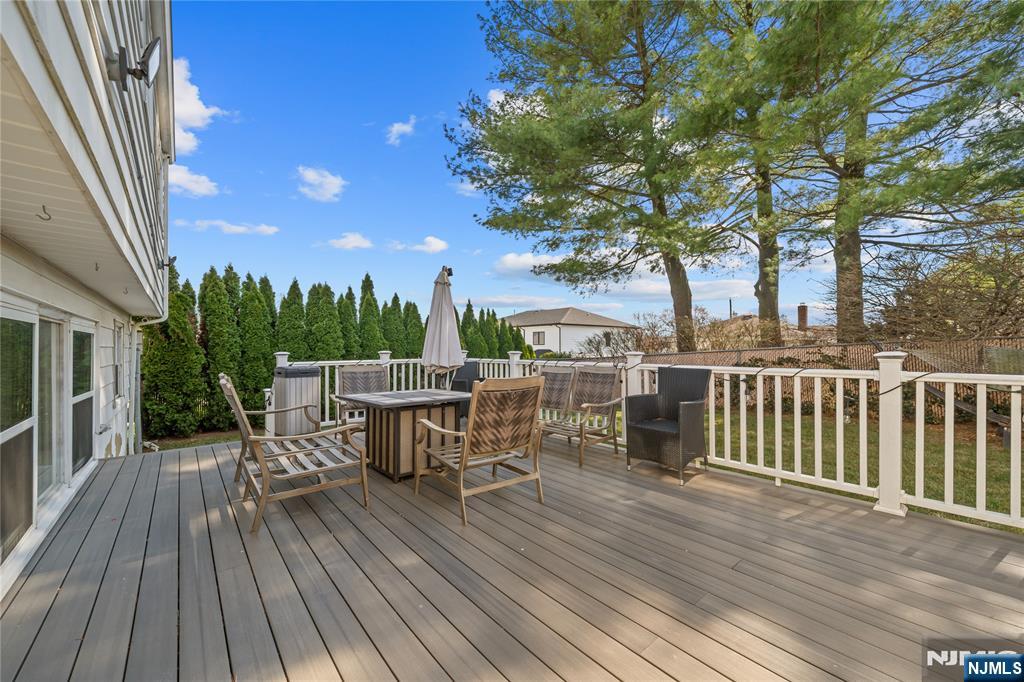 181 Haddenfield Road Clifton, NJ 07013 - Photo 26 of 34 a view of a chairs and table on the wooden deck