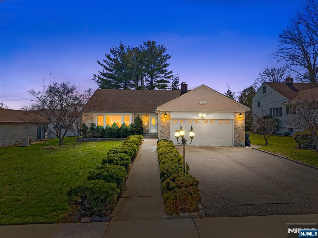 181 Haddenfield Road Clifton, NJ 07013 - Photo 34 of 34 a front view of a house with a yard and garage