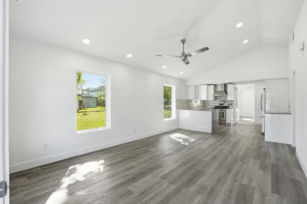 a kitchen with a white cabinets stove and sink