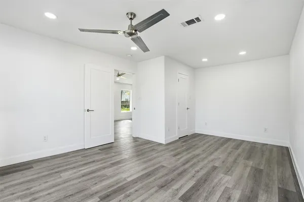 a bathroom with a sink shower and a mirror