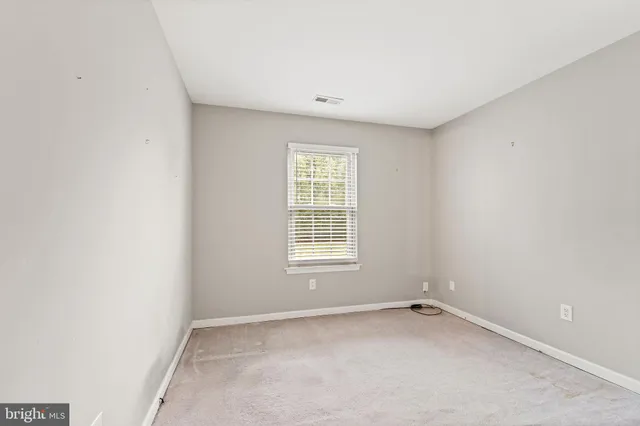 a view of a room that has a window in it