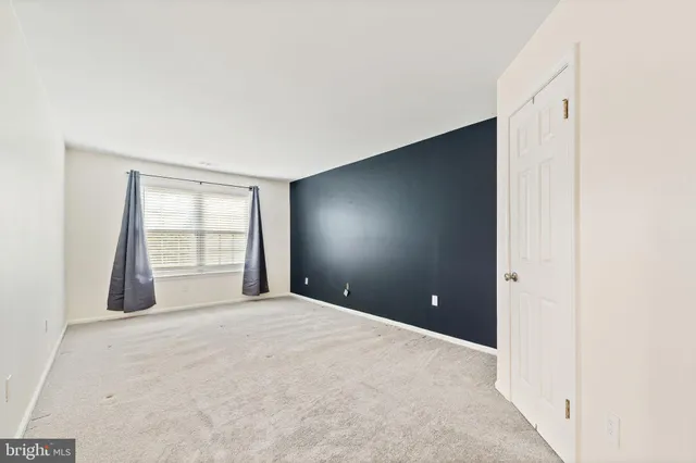 a view of a room with window and screen