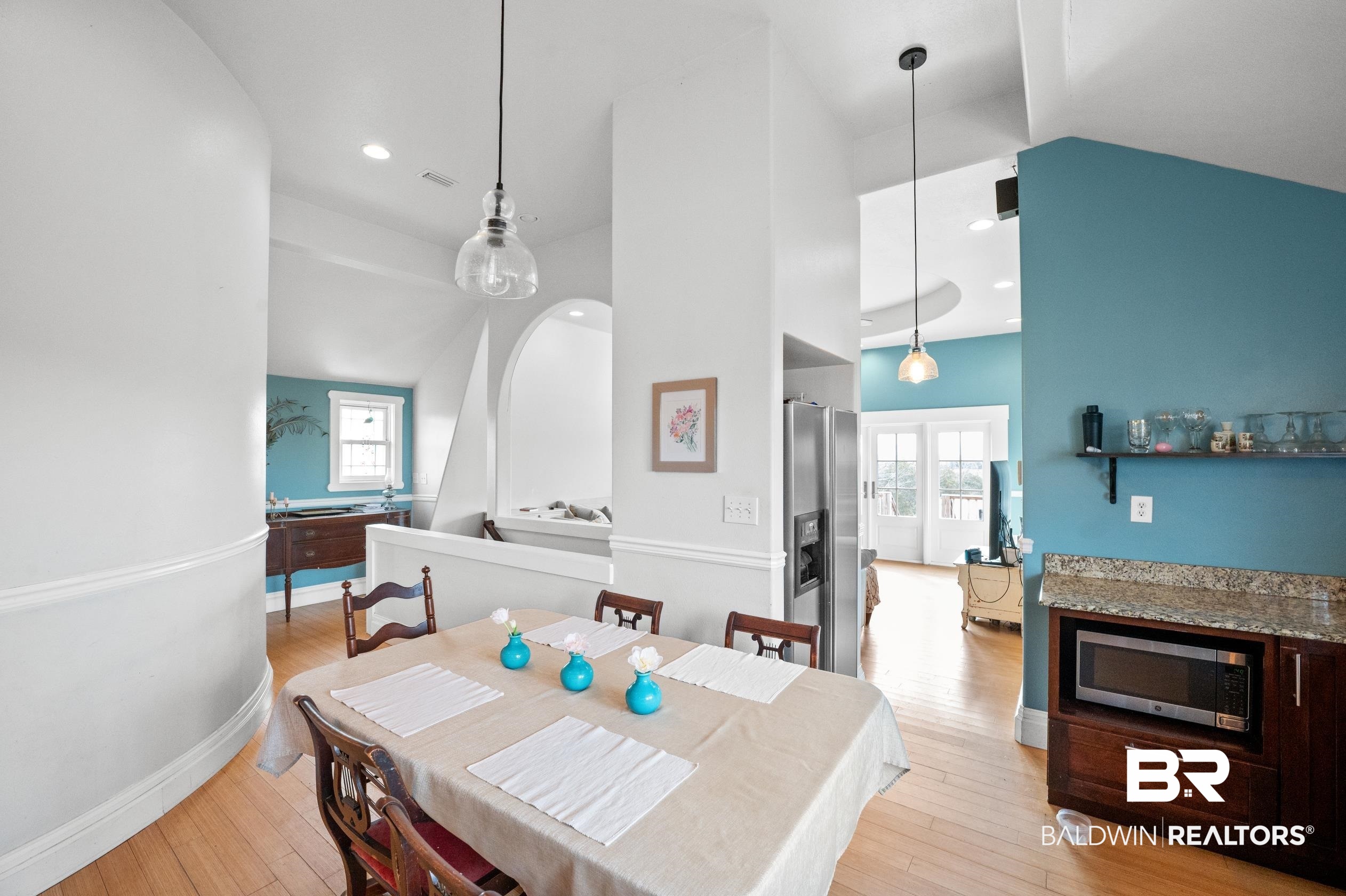13358 County Road 91 Elberta, AL 36530 - Photo 11 of 47 Dining area with high vaulted ceiling, plenty of natural light, and light hardwood / wood-style floors