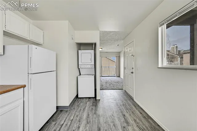 a view of hallway with wooden floor