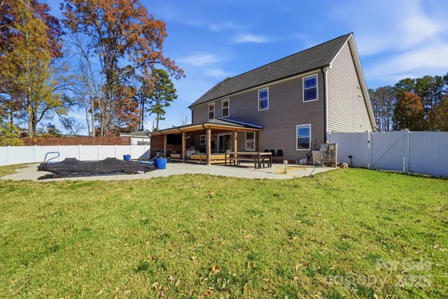 a front view of house with yard and seating area