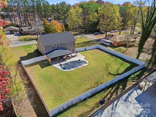 a view of a swimming pool with a lounge chairs