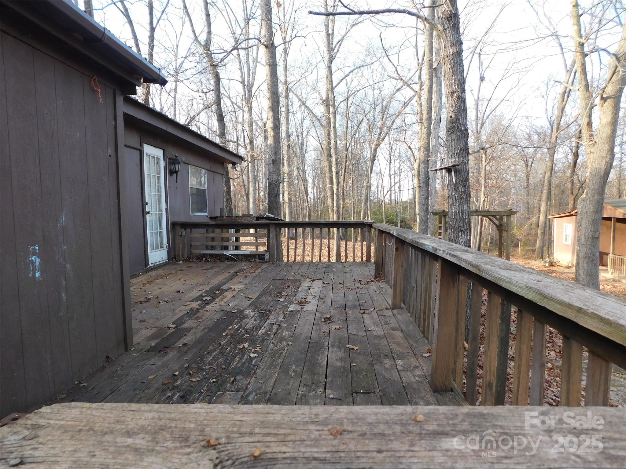 3028 Austin Chaney Road Monroe, NC 28110 - Photo 16 of 16 a backyard of a house with table and chairs