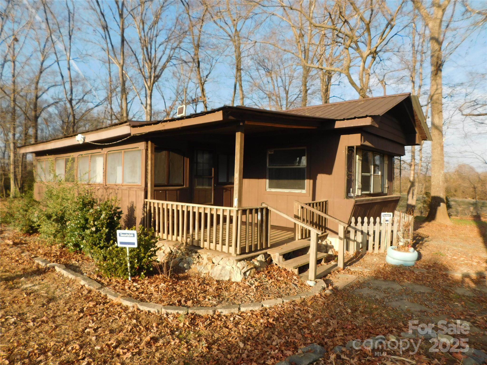 3028 Austin Chaney Road Monroe, NC 28110 - Photo 2 of 16 a front view of a house with garden