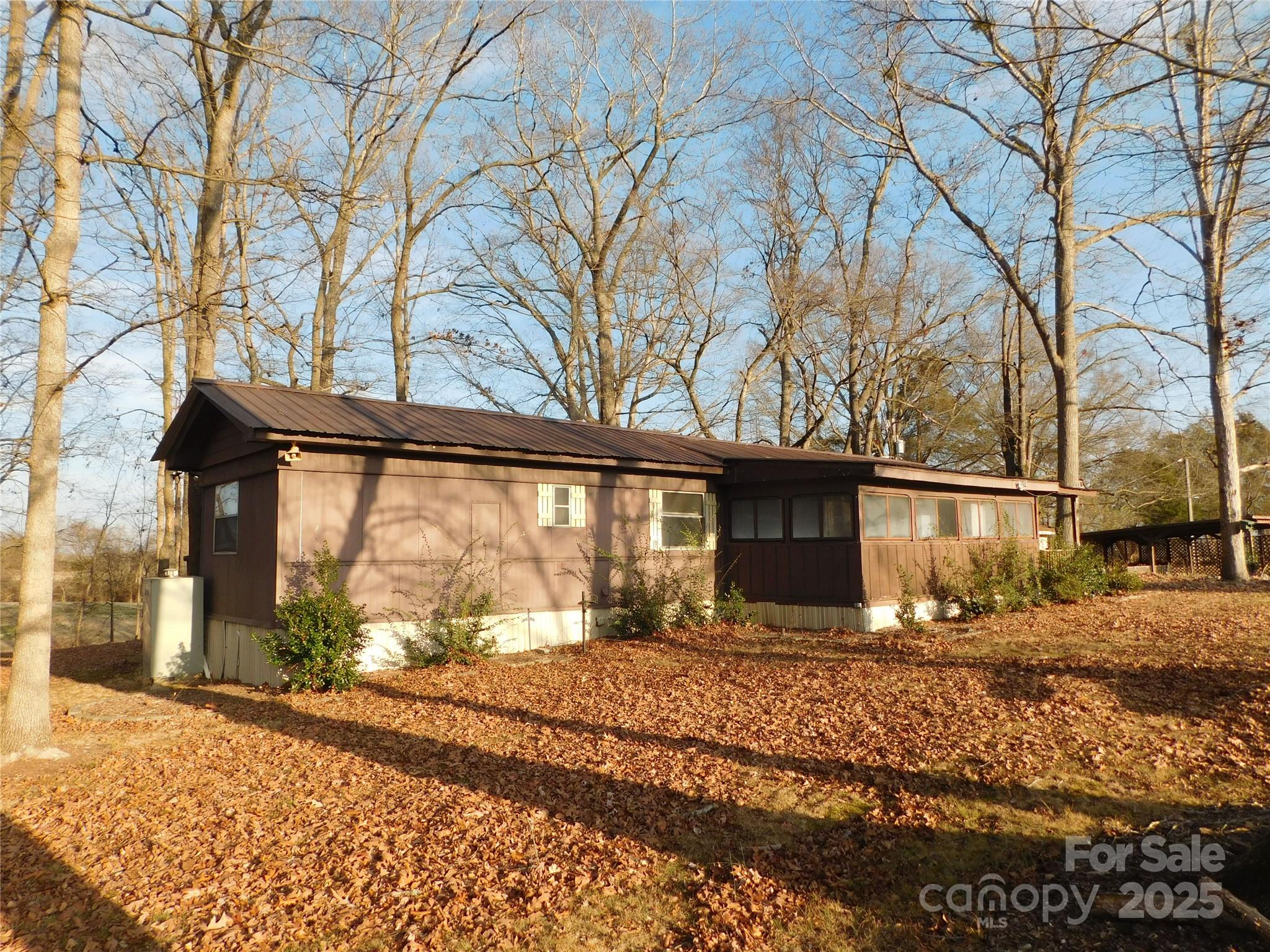 3028 Austin Chaney Road Monroe, NC 28110 - Photo 3 of 16 a view of a house with a yard