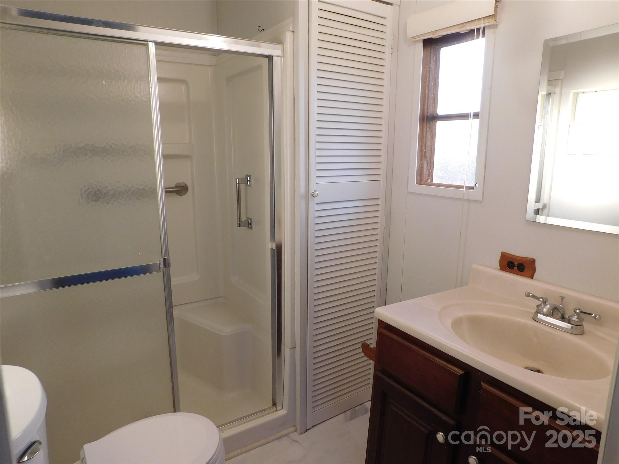 3028 Austin Chaney Road Monroe, NC 28110 - Photo 7 of 16 a bathroom with a sink toilet and shower