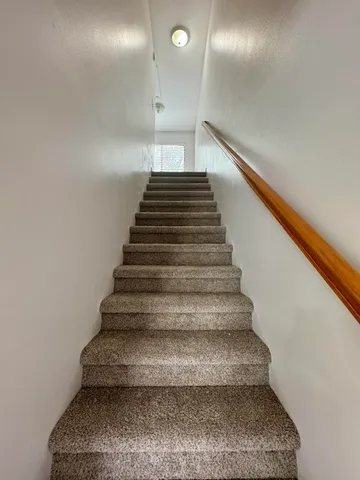 an empty room with wooden floor