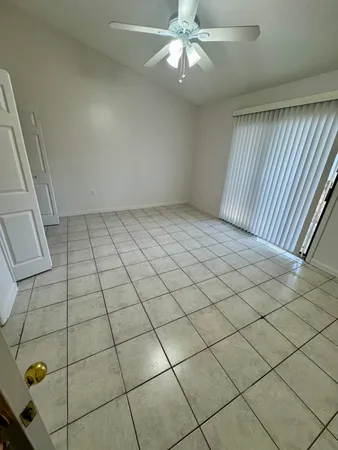 a view of a livingroom and window