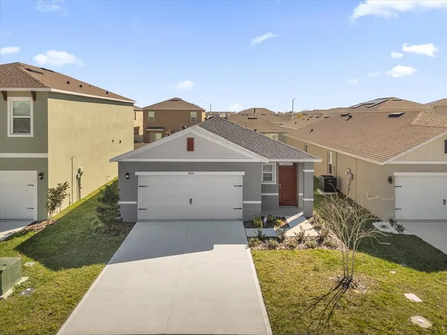 a view of a house with a yard