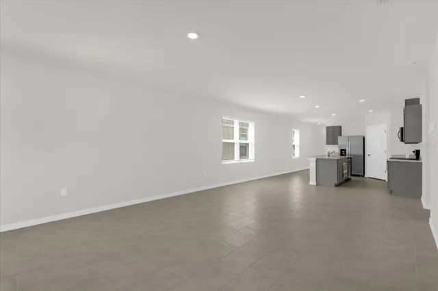 a view of a livingroom with furniture and windows