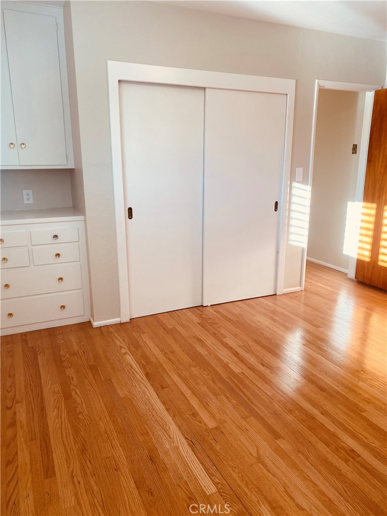 11745 Bryant Street Yucaipa, CA 92399 - Photo 12 of 28 a view of an empty room with wooden floor