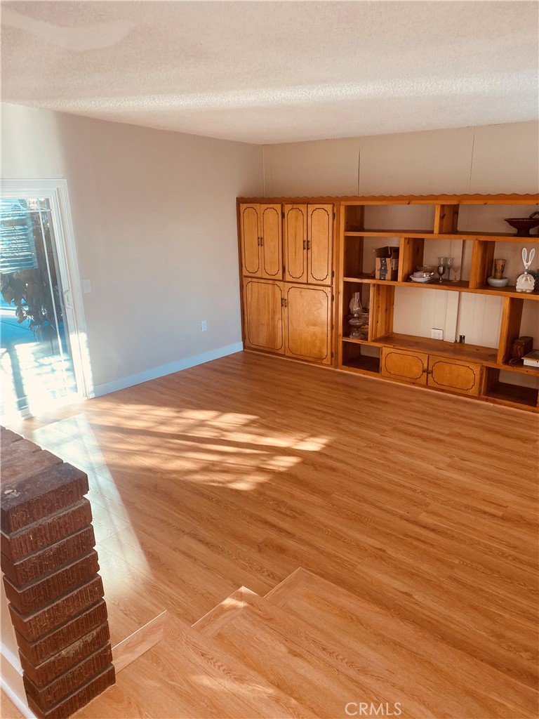 11745 Bryant Street Yucaipa, CA 92399 - Photo 16 of 28 a view of a livingroom with wooden floor