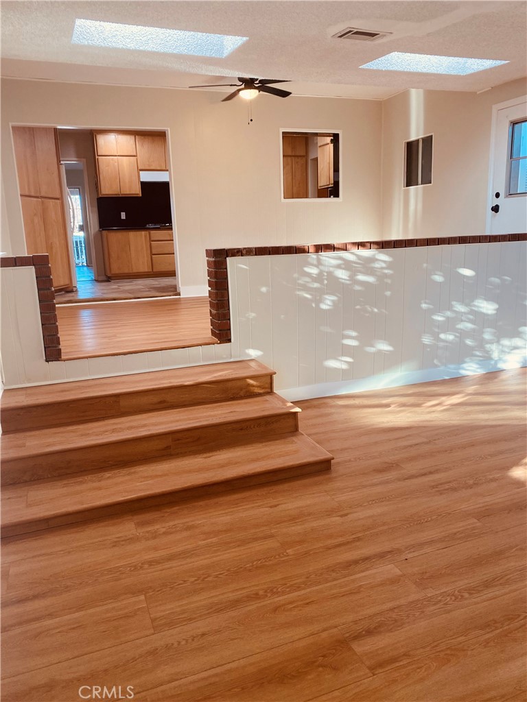 11745 Bryant Street Yucaipa, CA 92399 - Photo 17 of 28 a view of entryway and hall with wooden floor