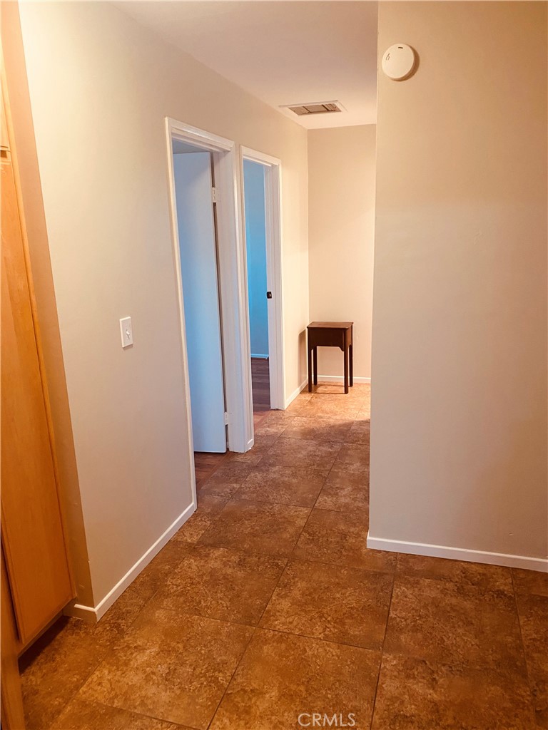 11745 Bryant Street Yucaipa, CA 92399 - Photo 18 of 28 an empty room with closet and entrance