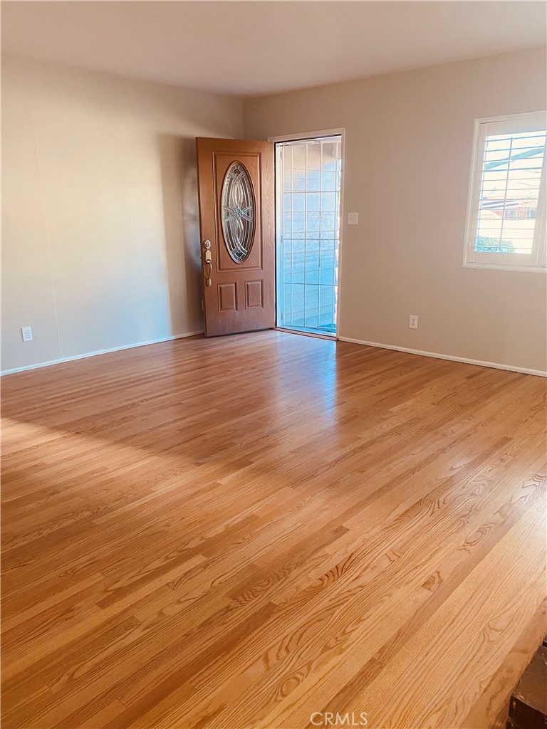 11745 Bryant Street Yucaipa, CA 92399 - Photo 5 of 28 a view of a room with wooden floor