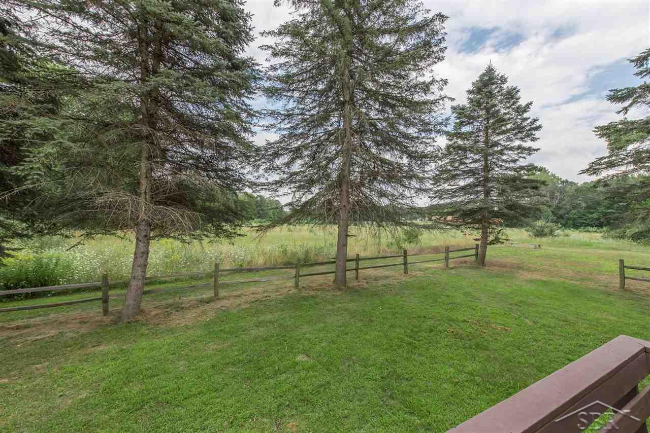 3201 Pomranky Road Midland, MI 48640 - Photo 23 of 29 From the deck, you overlook many acres of City parkland that extends beyond the property boundary.